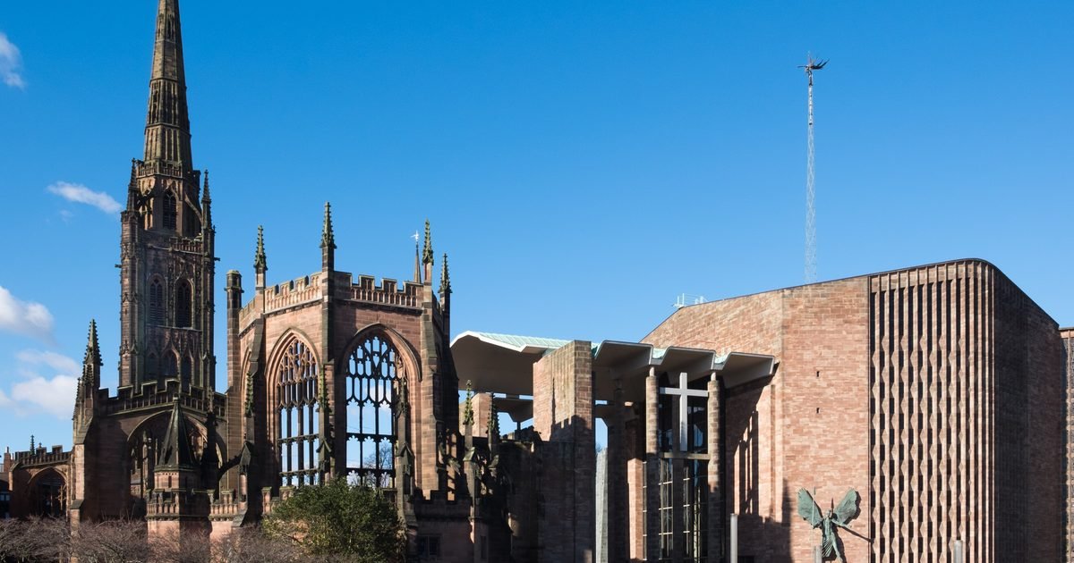 Coventry city centre showing the modern cathedral spire and the ring road overpass