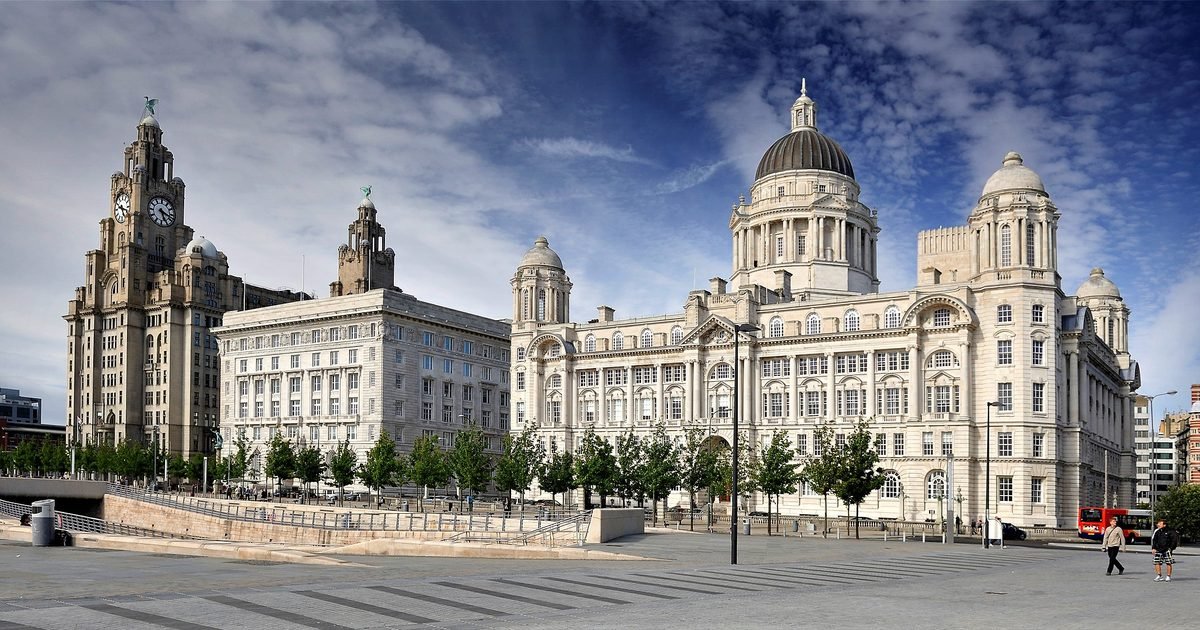 Liverpool waterfront at sunset showing the Royal Liver Building, Cunard Building and Port of Liverpool Building