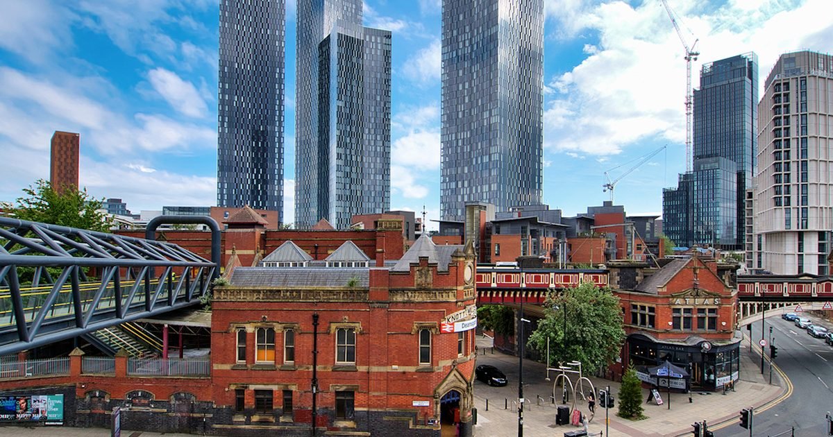 Manchester city centre skyline at dusk with Beetham Tower and modern office buildings